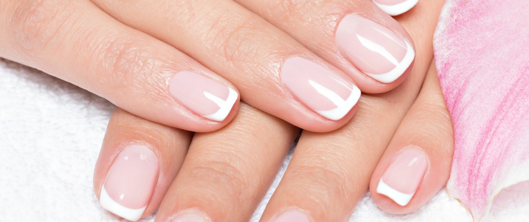 Beautiful woman's nails with french manicure